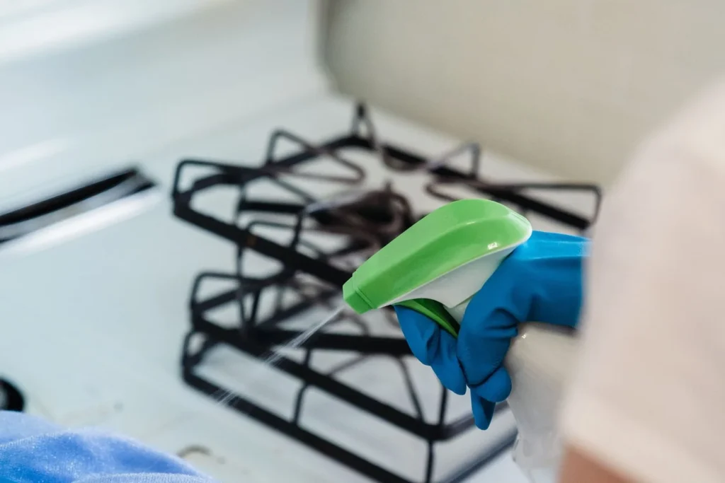 Stovetop detailing during deep cleaning